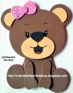 a brown teddy bear with a pink bow on its head