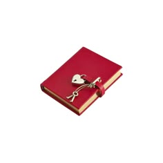 a red book with a heart shaped key attached to it