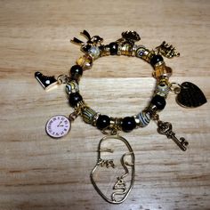 Black, Yellow And Gold Beaded Bracelet With Lovely Charms :Face, Converse, Clock, Key, Bow, Angel, Elephant And Heart. Can Be Made With Different Charms Or Silver. Rainbow Crystal Bracelet, Marc Jacobs Bracelet, Beaded Charm Bracelet, Gold Beaded Bracelet, Knot Bangle, Open Cuff Bracelet, Multi Strand Bracelet, Alex And Ani Bracelets, Gold Bead Bracelets