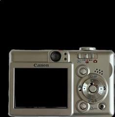 a silver camera with a white screen on it