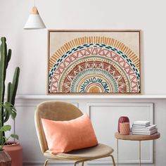 a living room with a chair, table and potted plant