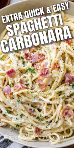 spaghetti carbonara with bacon and parsley in a white bowl on a checkered table cloth