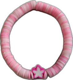 a pink and white bracelet with a heart on the front, and a bow at the end