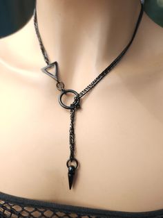 This is a bold and edgy blackened steel Lariat Goth Grunge Alt aesthetic Necklacevwrap choker with Spike pendant.  The minimalist design gives it a trendy and stylish feel, while the black steel gives it a touch of gothic Punk edge. This necklace is versatile, and can be worn long or doubled up for a layered look depending on what size you choose. Goth Jewelry Necklaces, Edgy Jewelry Aesthetic, Black Jewelry Aesthetic, Goth Jewelry Aesthetic, Grunge Jewelry Aesthetic, Goth Accessories Jewellery, Grunge Alt Aesthetic, Chokers Aesthetic, Punk Aesthetic Outfit