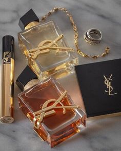 an assortment of perfumes on a marble surface