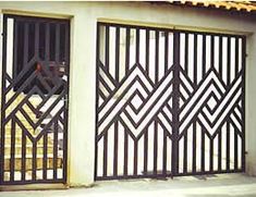 an iron gate on the side of a building