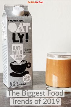 a carton of oat milk next to a drink