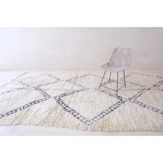 a chair sitting on top of a white rug