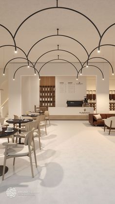 the interior of a restaurant with tables and chairs in white, wood and black colors