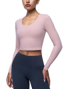 PRICES MAY VARY. Cream Collection Top: Crop tops are made from soft fabric that feels cream smooth on your skin. They are lightweight, breathable, quick-drying, moisture-wicking and resistant to sweat stains brings you the best sports experience. Removable Padding Bra: Yoga crop tops for women feature an inner removable cups with hidden small opening on both sides, easy to clean and adjust. The pad cups provide support and shock protection. U Neck Design: Athletic shirts tops cut with flattering u neck and will elastic transparent band that is not easily out of shape. fit your figure perfectly and fully demonstrate your charming neck and chest. Cropped Length: Sports tight long sleeve tees are cropped length design will a little short hem, chic and fashionable design, special slim fit and High Stretch Solid Tops For Pilates, Solid Scoop Neck Top For Pilates, Scoop Neck Athleisure Tops For Pilates, Solid Color Scoop Neck Gym Top, Fitted Pink Top For Pilates, Moisture-wicking Scoop Neck Top With Medium Support, Pink Moisture-wicking Tops For Pilates, Pink Workout Tops With Thumbholes, Medium Support Crew Neck Top For Pilates