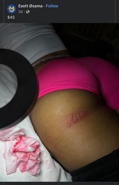 a pregnant woman's stomach with the word mom written on it in cursive writing