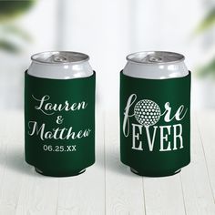 two green and white can coolers sitting on top of a wooden table