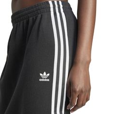 Sporty and feminine unite in the adidas Knitted Women's Skirt. When you want an outfit you can throw-on easily, this skirt makes it possible. Match it with other adidas apparel or a solid-colored tank for a simple look that makes a statement! Features adidas iconic three-stripe design. Provides for sleek silhouette. Has adjustable, elastic waistband. Fabric: 79% Cotton, 21% Polyester. Product consists of recycled materials. Made from Better Cotton. Machine washable. Casual Ribbed Bottoms, Black Ribbed Cotton Bottoms, Casual Black Ribbed Skirt, Spring Sporty Ribbed Bottoms, Ribbed Sports Bottoms For Spring, Spring Sports Ribbed Bottoms, Black Athleisure Skirt For Spring, Spring Black Athleisure Skirt, Casual Ribbed Mini Skirt