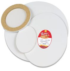 two white plates with gold rims on each side and one has a brown circle in the middle