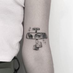 a woman's arm with a tattoo on it that has a sink and faucet