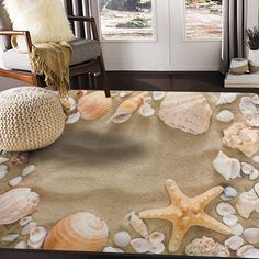 an area rug with seashells and starfish on it