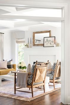 a living room filled with furniture and a fire place