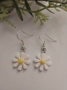 Stay down to earth with handmade floral beaded jewelry, Choose the natural look with cool shades and daisy patterns. - Have some fun in the sun with these new novelty jewelry styled as your favorite life art! - Unique earrings perfect for any season or dressing up at any occasion.  - New year pattern, handmade with love in USA - High quality stainless steel hooks and plastic daisy charms. - Size: 35mmx17mm. - Stylish to wear and make an ideal gift for Mom, sister, friends, family... - Free shipp Trendy Flower-shaped Summer Jewelry, Adjustable White Flower Earrings For Spring, Cute Flower Jewelry For The Beach, White Handmade Flower Earrings, Trendy Nickel-free Flower Earrings, Summer Flower Charm Jewelry, Cute Flower Shaped Beach Jewelry, Cute Summer Flower-shaped Earrings, Cute Flower-shaped Beach Jewelry