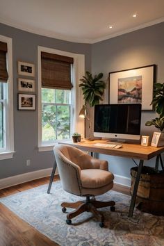 When setting up your cozy home office, think about adding plush seating like a comfy armchair or sofa. Use soft textiles, including a fluffy rug, throw pillows, and a blanket, to layer the area. Add personal items, like framed artwork, family photos, or a small bookshelf, to make it uniquely yours. Cozy Office Space With Couch, Desk With Rug Under, Cozy Coastal Office, Home Work Area Ideas, Home Office Gray Walls, Small Office With Tv, Small Office Ideas No Windows, Living Room With Desk Area Layout, Cozy Modern Office