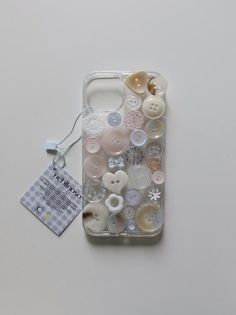 an iphone case with buttons attached to it