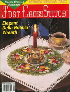 a magazine cover with a candle on the table