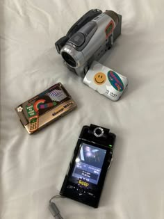 there is a camera and other items on the bed