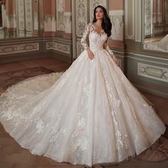 a woman in a wedding dress posing for the camera