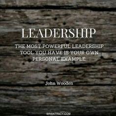 a wooden background with a quote from john woden that says,'the most powerful leader is to tool you have in your own personal example