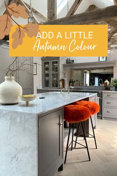 a kitchen island with stools in the middle and an open floor plan on the other side