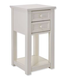 a small white table with two drawers on it's sides and one drawer open