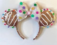 a minnie mouse ears with some candy on it