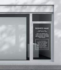 an empty storefront with glass doors and signs on the front window, in black and white