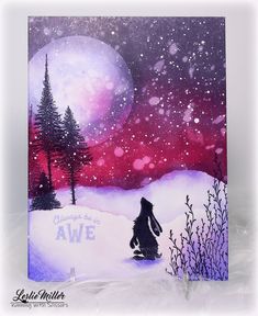 a handmade christmas card with an image of a person sitting in the snow at night