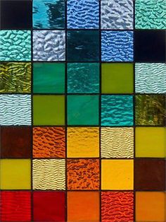 a multicolored glass window with different colors