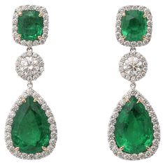 Incredible Green color! Gorgeous emerald and diamond drop earrings. 15 carats of cushion cut and pear shaped emerald drops. 4.31 carats of white round brilliant cut diamonds. Set in 18k white gold. 1.5 inch length. Certified by Christian Dunaigre of Switzerland. The certificate is available on request for serious inquiries. Pictures do not do these emeralds justice! Diamond And Emerald Earrings Studs, Diamond Emerald Earrings, Emerald Drop Earrings, Emerald Earrings Drop, Emerald Diamond Earrings, Droplet Earrings, Diamond Earrings Design, Earrings For Sale, Earrings Design