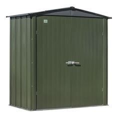 a green metal storage shed with the door open on an isolated white background for text