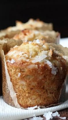 coconut muffins sitting on top of a white cloth