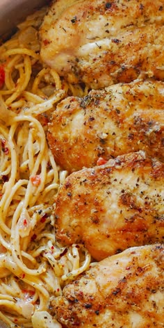 some chicken and pasta are in a pan