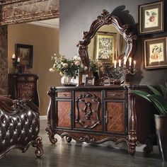 a bedroom with a bed, dresser and mirror in it's centerpieces