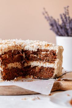 a piece of cake with white frosting on top