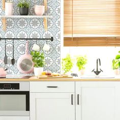 the kitchen is clean and ready to be used as a place for potted plants