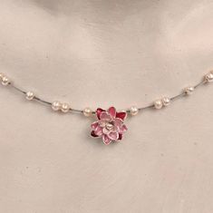 The water lily is made of recycled 935 silver and is hand-painted in different shades of pink with a special varnish and burned in. The small freshwater cultured pearls are fixed on a stainless steel cable. The clip closure, also made of stainless steel, is very easy to operate. With a length of 42 cm, the playful necklace is ready to be shipped immediately. It can also be made in other lengths on request. Supplied in an elegant black jewelry box. The model bust in the photos is life-size. The w Water Lily Necklace, Water Lily Jewelry, Pink Water Lily, Black Jewelry Box, Fairy Tale Jewelry, Lily Necklace, Blossom Jewelry, Pink Water, Stainless Steel Cable