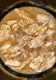 chicken and gravy cooking in a skillet