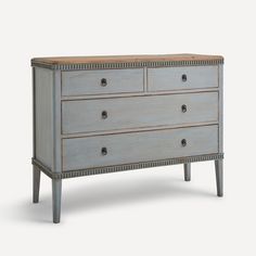 an old dresser with two drawers and one drawer on the bottom, in grey paint