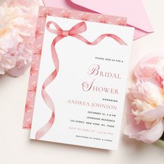 a pink and white bridal shower with flowers