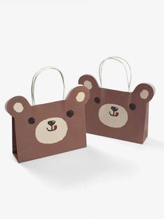 two brown paper bags with bears on them