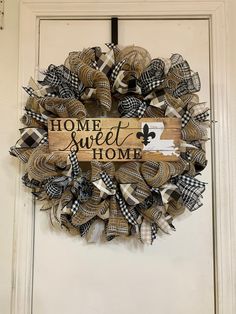 a wreath with the words home sweet home on it