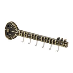 an antique style guitar hanger on a white background