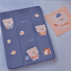 there are some stickers on the back of a case with bears and birds in it