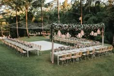 an outdoor wedding setup with tables and chairs